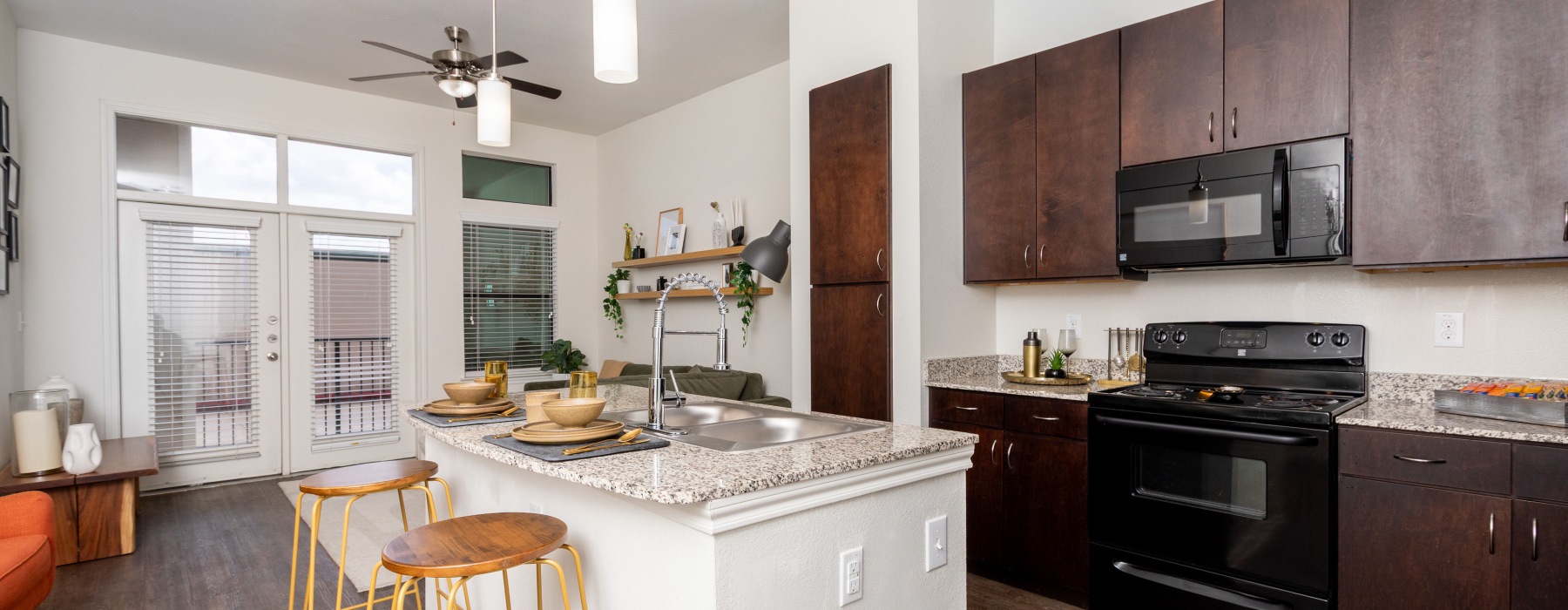 a kitchen with wood cabinets