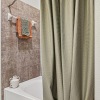 a bathroom with a bed and a bathtub