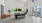 a room with a pool table and chairs and two tv's