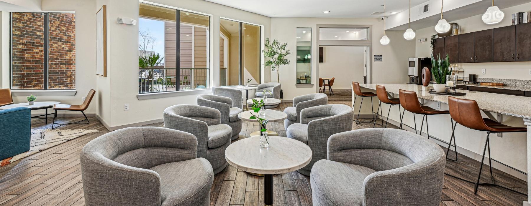a large room with a table and chairs