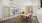 a private clubhouse room with a large glass door and a tv