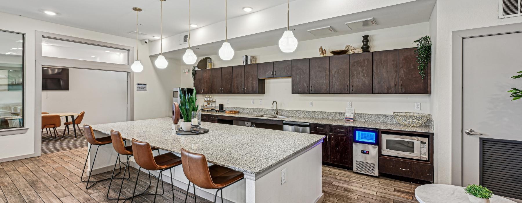a clubhouse kitchen with a large island