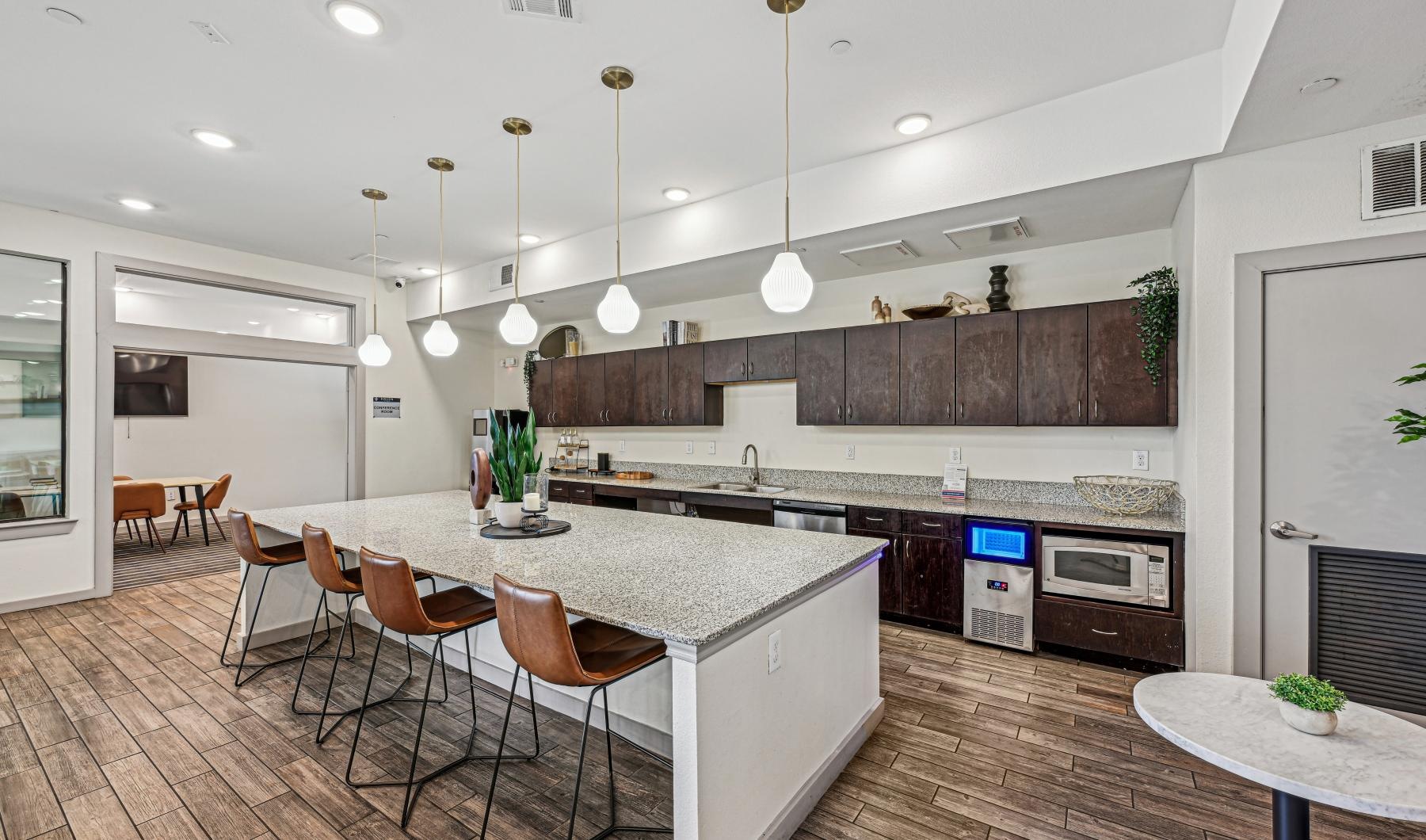 a clubhouse kitchen with a large island